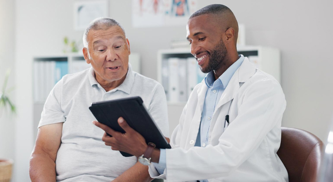 A physician reviewing care with a patient